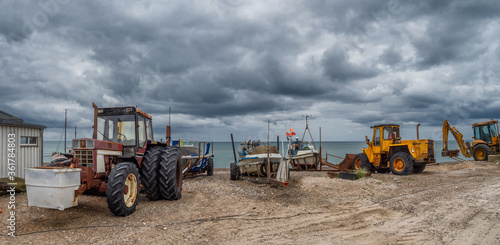 Coastal cutter on the beach at Lild Strand in Thy, Denmark photo