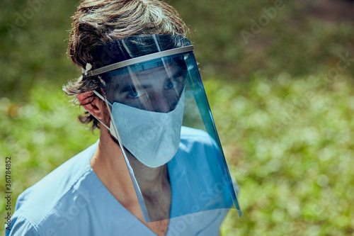 Outdoor portrait of doctor with protective mask against covid 19