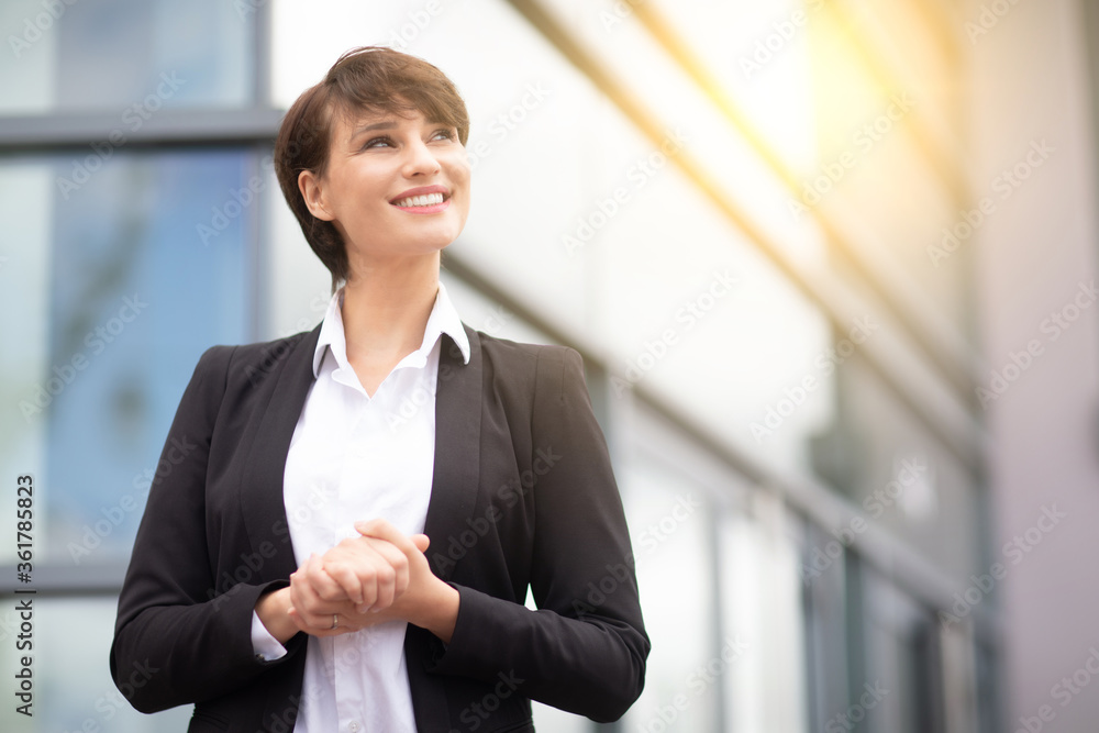 an expressive and happy businesswoman outside an expressive and happy businesswoman outside