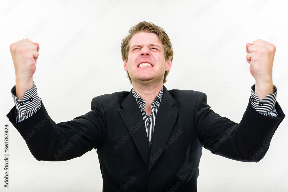 Portrait of stressed young businessman looking angry Portrait of stressed young businessman looking angry