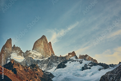 Amazing view of Mount Fitz Roy at sunset with golden light on the rocks