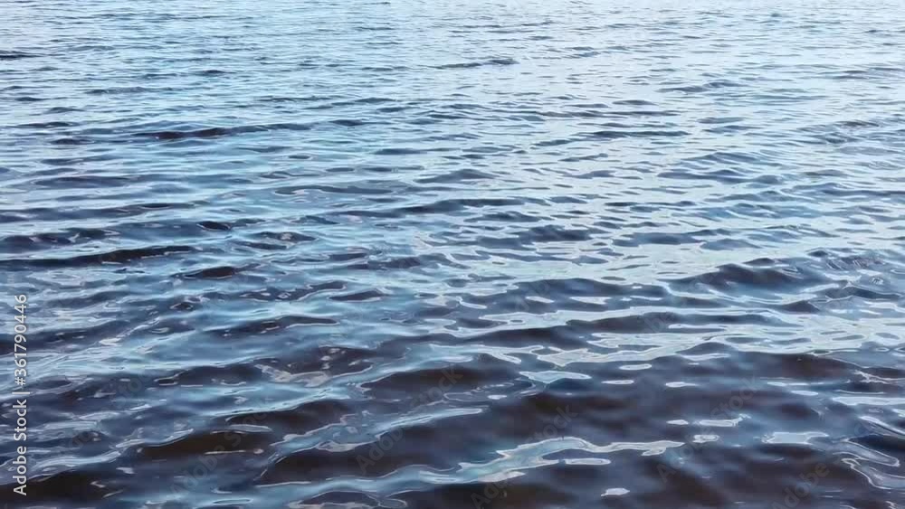 Sea waves slow motion. water surface with ripples. calm and relaxing background Sea waves slow motion. water surface with ripples. calm and relaxing background