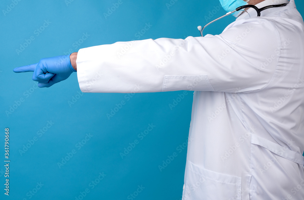 medic man in white coat with buttons, on hands wearing blue sterile gloves medic man in white coat with buttons, on hands wearing blue sterile gloves