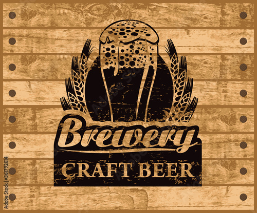 Label or banner for craft beer with overflowing glass of frothy beer, ears of wheat and inscriptions on background of wooden planks. Vector emblem or illustration in retro style for brewery, pub, bar