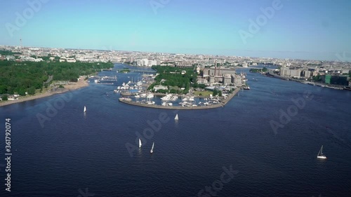 SAINT-PETERSBURG, RUSSIA JUNE 21 2020: Flying helicopter over marine yacht port photo