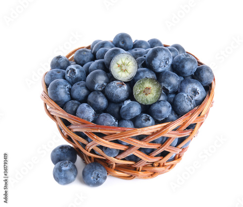 Wallpaper Mural Fresh tasty blueberries in wicker basket isolated on white Torontodigital.ca