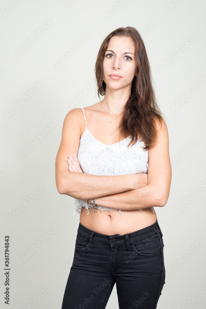 Portrait of young beautiful woman with arms crossed Portrait of young beautiful woman with arms crossed