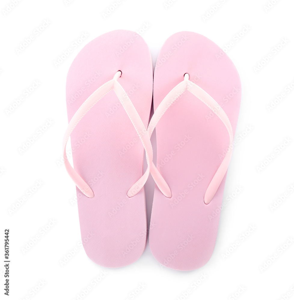 Light pink flip flops isolated on white, top view. Beach accessory