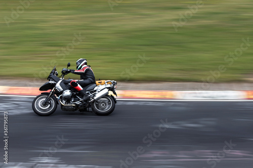 motorcyclist speed blur on a race track © Tobias Arhelger