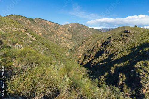 mountainous landscape with a canyon in the center © Javier