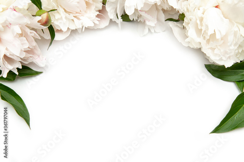 Flowers frame background. White paper card with peonies. Workspace. Blank for greetings