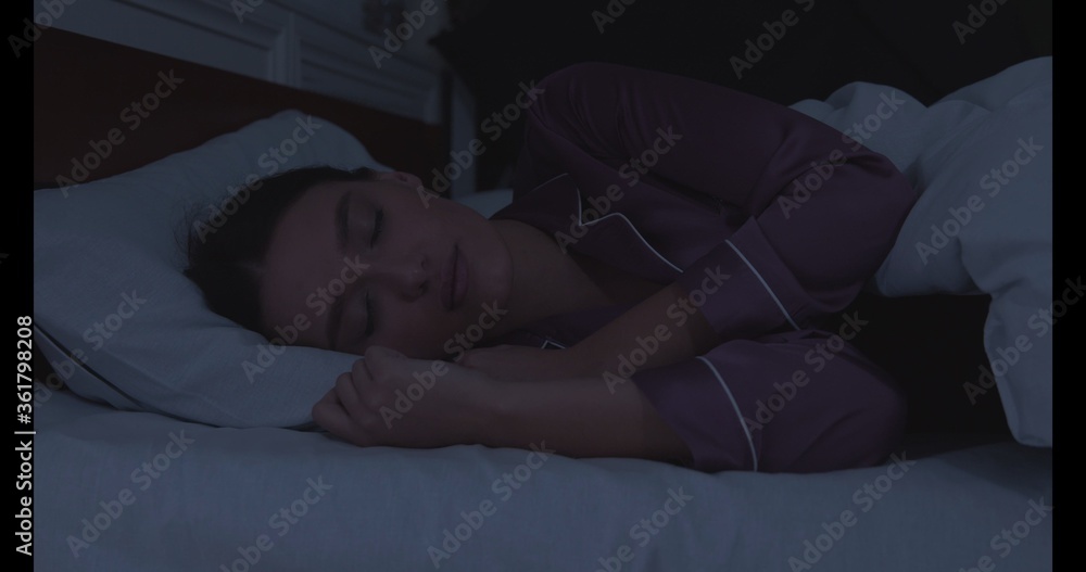 Portrait of millennial woman sleeping in bed Portrait of millennial woman sleeping in bed
