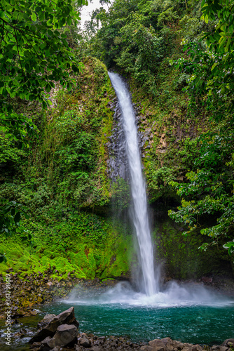 La Fortuna Waterfall in a forest, close to Arenal Volcano, Costa Rica national park. Central America.