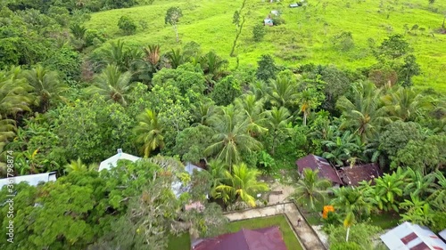 Flight backward over the Christian village of Tungu in the Aru islands archipelago in Indonesia, between Papua and Australia. photo