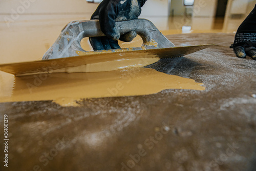 Epoxy resin applied to the floor. Industrial hall with colored floor