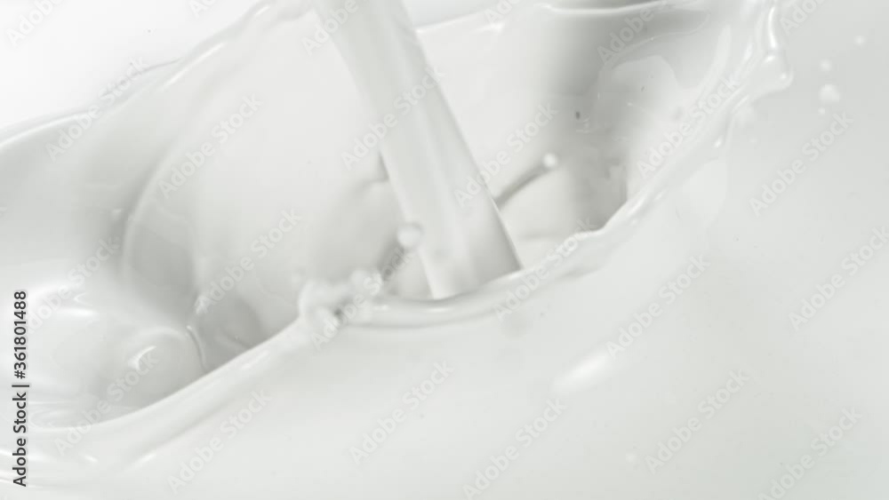Super slow motion of pouring milk stream, macro shot. Filmed on high speed cinema camera, 1000fps. Super slow motion of pouring milk stream, macro shot. Filmed on high speed cinema camera, 1000fps.