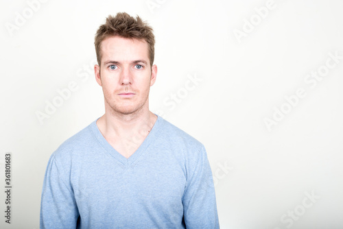 Portrait of handsome man looking at camera
