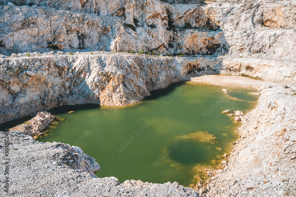 beautiful view of the quarry with a small lake in the middle beautiful view of the quarry with a small lake in the middle