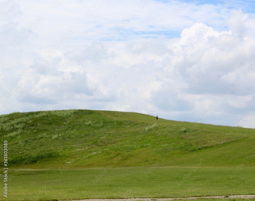 The clouds in the background of the green hill landscape. The clouds in the background of the green hill landscape.