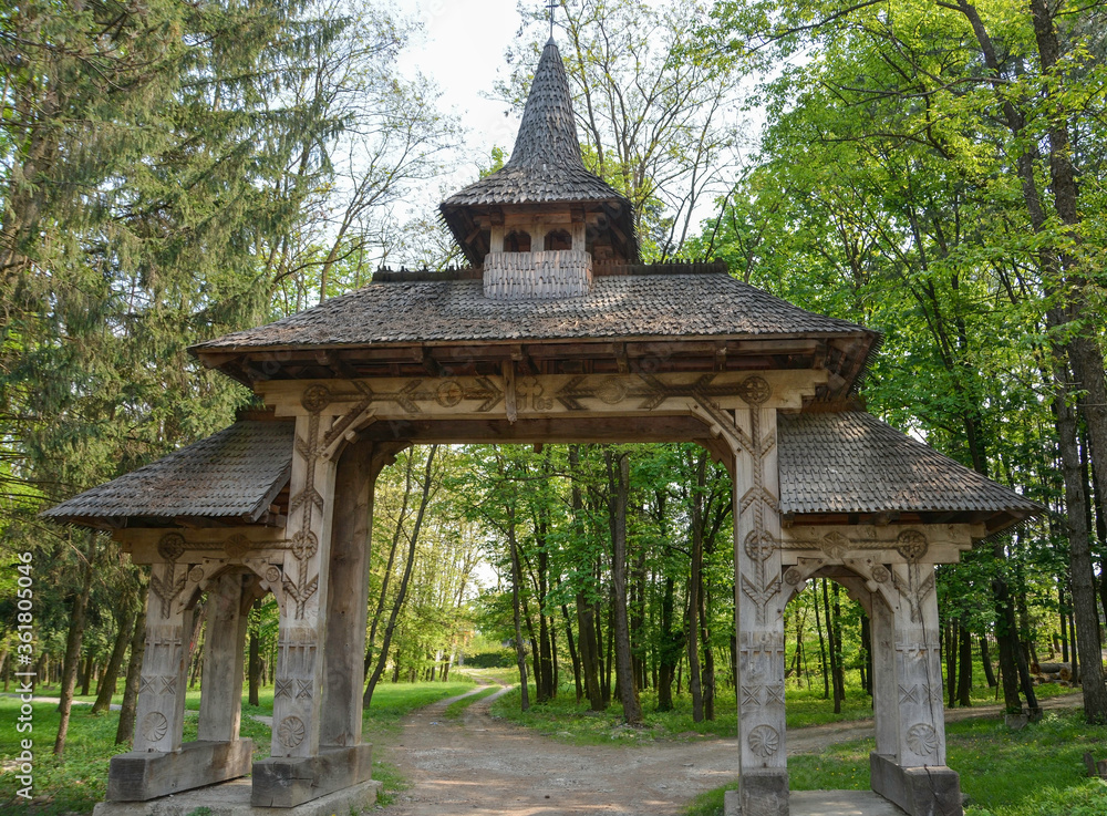Sapanta Peri Monastery, Maramures, Romania, Europe..Spring 2018. Traditional wooden door carved by hand on the way to the Sapanta Peri Monastery Sapanta Peri Monastery, Maramures, Romania, Europe..Spring 2018. Traditional wooden door carved by hand on the way to the Sapanta Peri Monastery