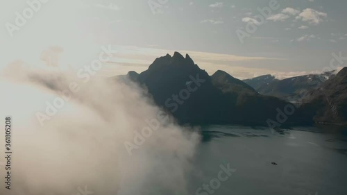 Aerial top view on the mountains ridge with clouds. Adventure journey traveling outdoor in Norway active vacation concept. Segla mountain, Senja, Norway. photo