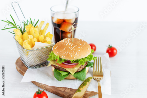 Fast food burger menu, french fries and cola drink on white background.