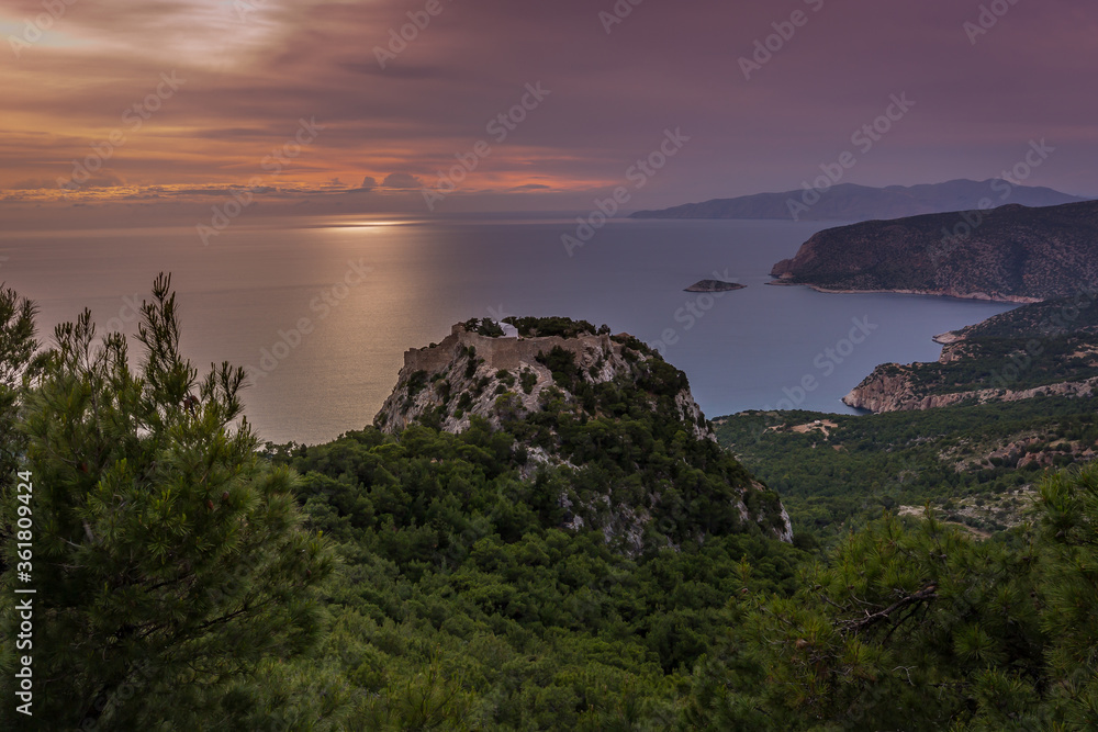 A sunset view of Monolithos Castle on the Greek island of Rhodes