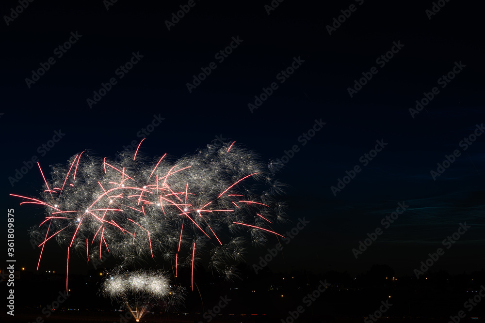 multiple fireworks in the dak sky