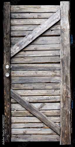 A makeshift door made of old planks covered with a weatherproof coating