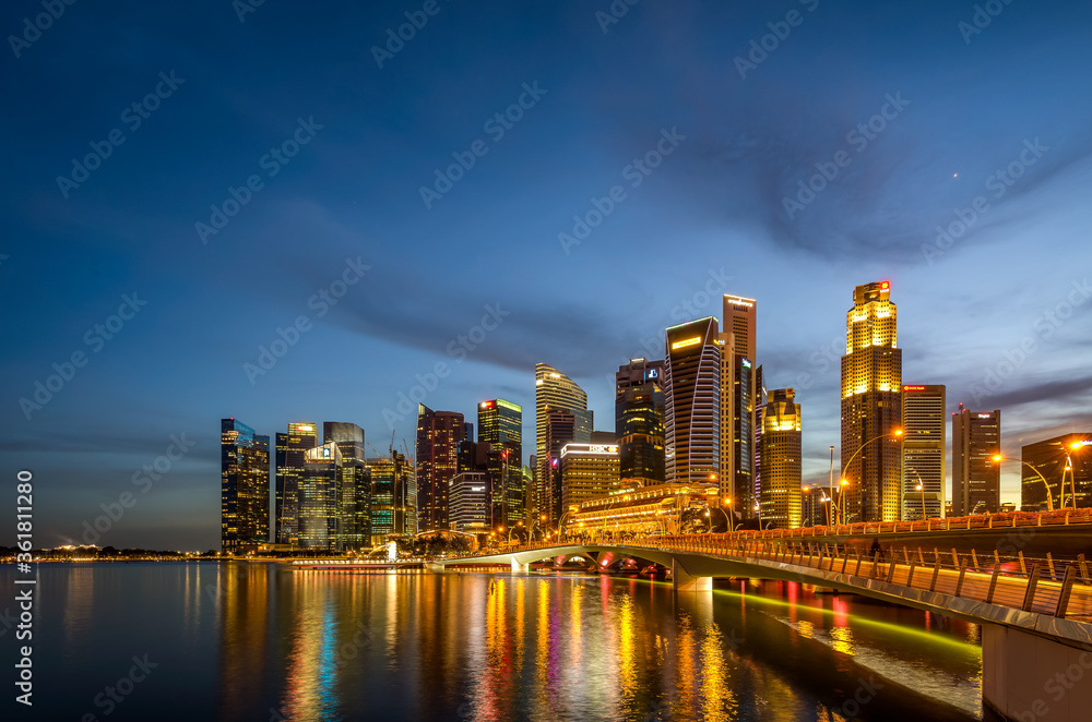 Singapore 2019, iconic view from Singapore river to Marina Bay Sands and Central Business District. Blue hour reflection on the water during sunrise sunset