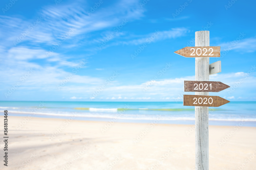 wooden sign on sand beach for outdoor advertising summer vacation concept, for your text.