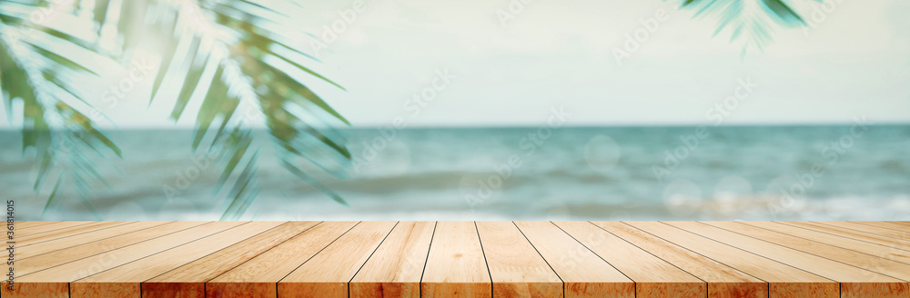 Panoramic empty clean wood counter table top blur shinny white bokeh light on summer beach background for product morning scene display montage, Abstract Blurry wooden desk in vacation trip backdrop. - obrazy, fototapety, plakaty 