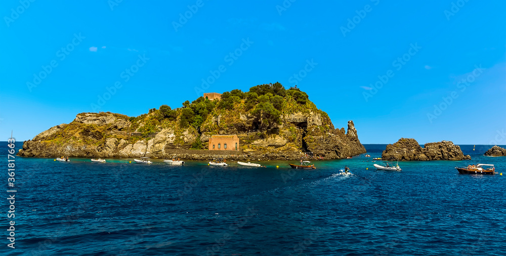 The Isole dei Ciclopi island and stacks offshore Aci Trezza, Sicily in summer