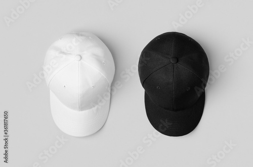 Photography White and black baseball caps mockup, side by side.