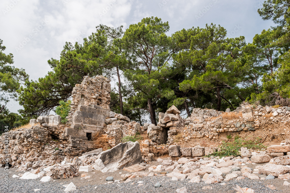 Ancient cemetery. Ruins of Phaselis city in North harbour. Famous architectural landmark. Turkey.