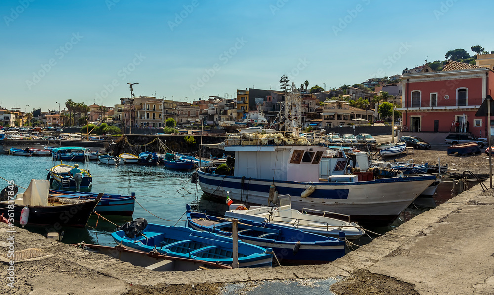 Traditional fishing boats in the harbour at Aci Trezza, Sicily in summer