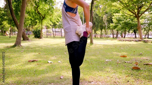 Body of a young woman who is doing exercises in a park © Shenzen Photo Lab