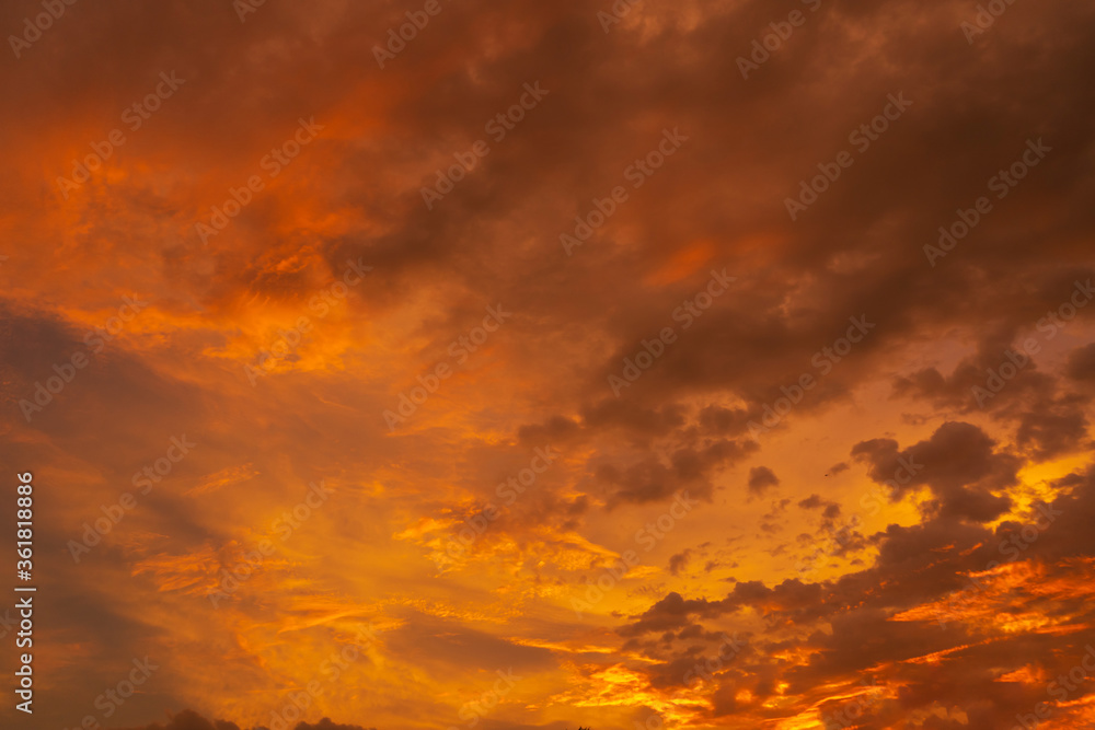 unusually beautiful fiery red tropical sunset. Burning clouds. Fire in the sky