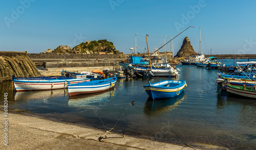 Fishermen s boats against a background of Isole dei Ciclopi at Aci Trezza  Sicily in summer