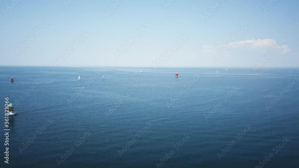 aerial view of lot of sailing yachts sail open sea, ocean. sport competitions. Amazing blue water. 4k Drone video aerial view of lot of sailing yachts sail open sea, ocean. sport competitions. Amazing blue water. 4k Drone video