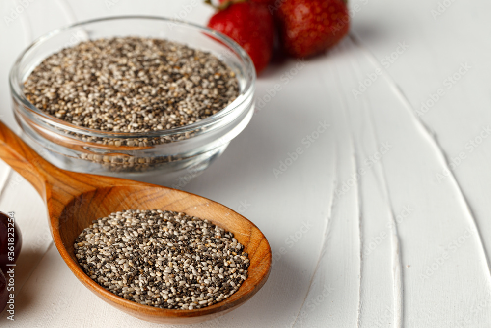 Bowl with raw chia seeds close up Bowl with raw chia seeds close up