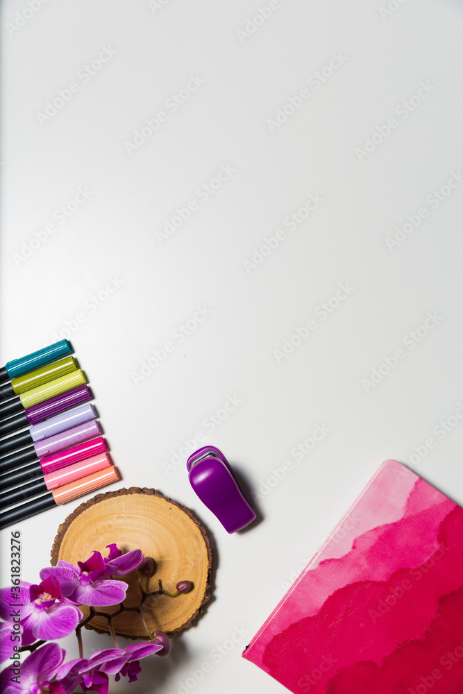 Art supplies on a white desk shot from high angle. Creative workplace concept Art supplies on a white desk shot from high angle. Creative workplace concept