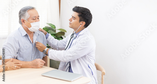Doctor using stethoscope for auscultate Asian grandfather patient while, Medical healthcare service during Coronavirus. Life insurance, and Elderly society, Prevent epidemic concept with copy space