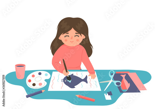 Child painting and cutting paper. Little girl makes crafts. Children creativity and imagination development playing concept. 