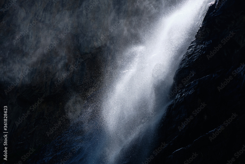 Fototapeta premium water falling at high speed in a ray of light