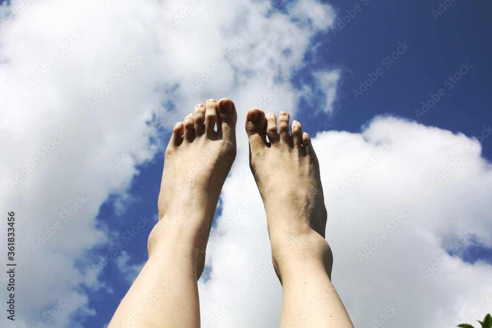 Feet on the sky and clouds.