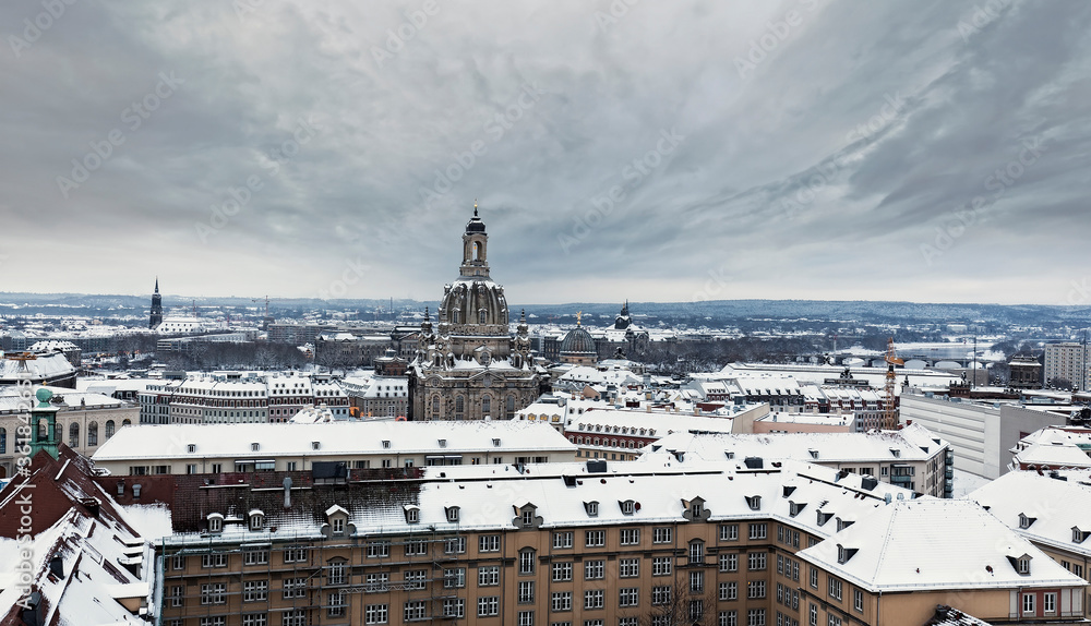 Snowy roofs of Dresden at dusk, Germany