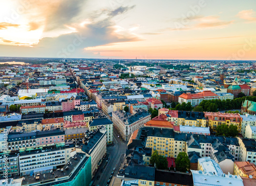 Aerial sunset view of beautiful city Helsinki . Colorful sky and colorful buildings. Helsinki, Finland. 