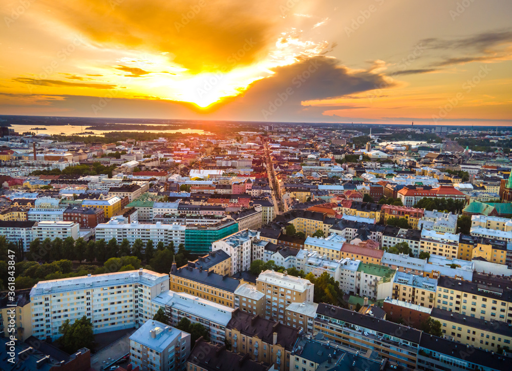Aerial sunset view of beautiful city Helsinki . Colorful sky and colorful buildings. Helsinki, Finland.	