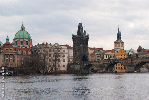 Panorama of the city of Prague, Czech Republic on a sunny day. View of Charles Bridge and the bank of the Vltava River.